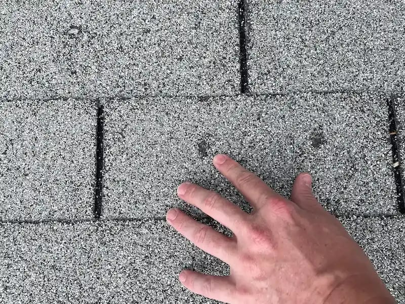 High Impact estimator documenting hail damage on a Denver roof for an insurance supplemental claim